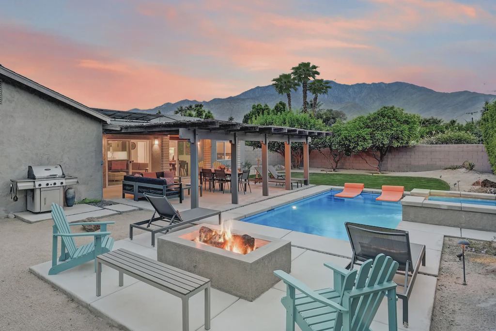 Racquet Club South House | Living Room - Discover sunny Palm Springs from this modern and chic vacation rental, featuring open-concept living and ample outdoor space.