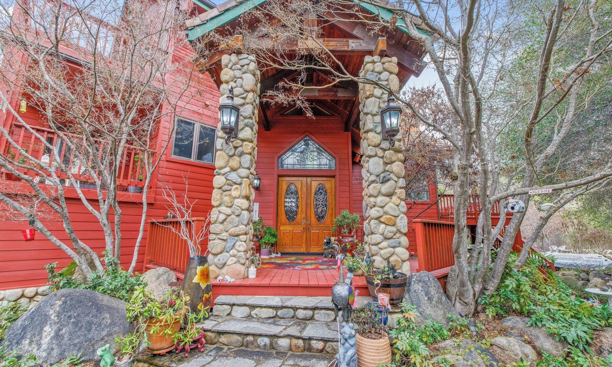 Three Rivers Ski Chalet | Majestic Riverfront Chalet is set down a serene and private drive.