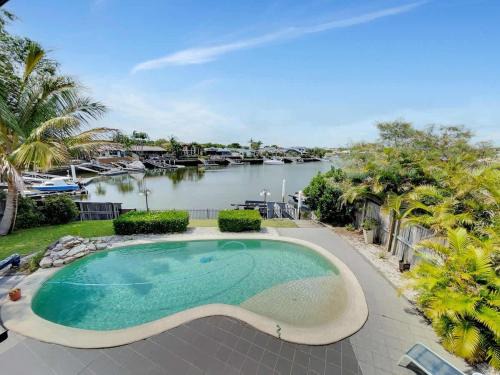 Banksia Beach House | Spacious Family & Pet-friendly Home on the Canal