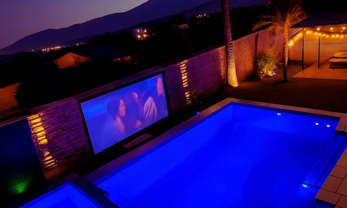 Terra Lago House | This spacious Indio home is designed for families, golf trips, festival weekends, and guests who want built-in entertainment. Enjoy a private saltwater pool, free spa, golf simulator, poolside cinema, game room, glamping yurt, hammocks, and karaoke.