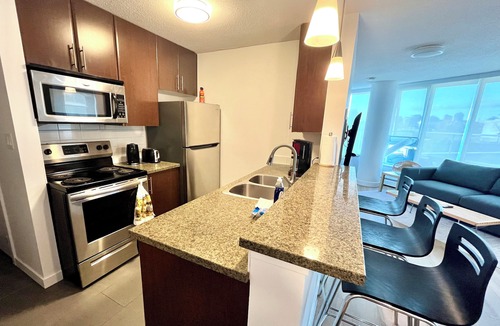 Crosstown Apartment | 2BR+Sofabed, 2Bath, Private 500sqft sundeck, EV Parking w/Pool, Sauna, Hot Tub