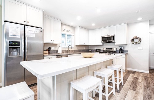 West Newport House | Beach House for Family Trips to the Coast, Steps to Sand with A/C and Sunny Patio