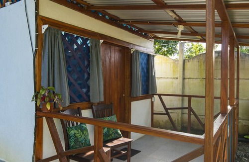 Manzanillo Cabin | Beachfront Casita for 2, loft-style double bed & kitchenette with shaded porch