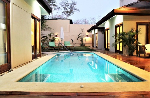 Playa Langosta House | Blue Iguana, steps from the beach.