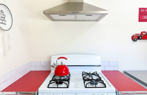 Coalinga House | Escape to our cozy, retro-inspired haven in Coalinga, just minutes from the town center. Perfect for business or leisure, this vibrant home comfortably accommodates guests with a queen pull-out couch.