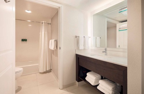Raisin Hotel | Fresno Hospitality: Enjoy Homely Comforts with Pool and Kitchen | Two Suites