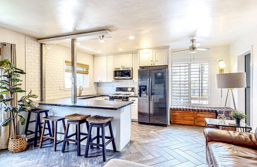 Corridor Apartment | Inviting apartment with grill, balcony, full kitchen, & W/D