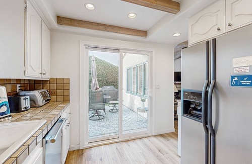 East Beach House | Lovely home with furnished patio, grill & ocean views - close to the beach