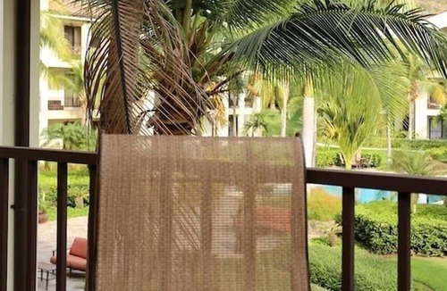 Coco Condo | Luxe! Impressively designed 2nd-floor unit in Coco done in red and orange hues
