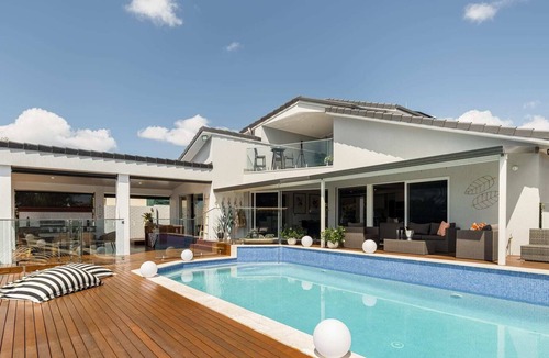Runaway Bay House | Modern Waterfront Retreat| Private Pool & Dock
