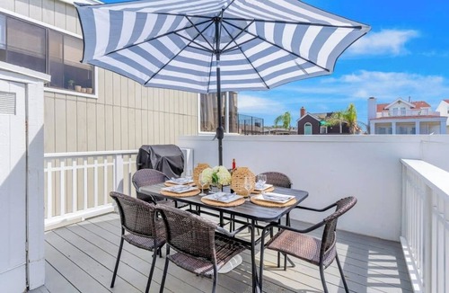 West Newport House | Second-story beach cottage with a furnished deck, AC, W/D, & garage parking