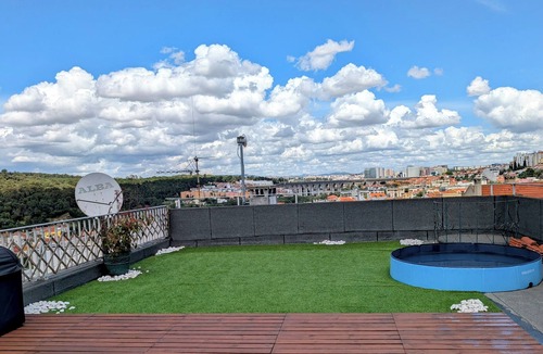 Santo Condestavel Apartment | Spacious 2-Bedroom Duplex with Private Roof Deck and Gym in Campo de Ourique