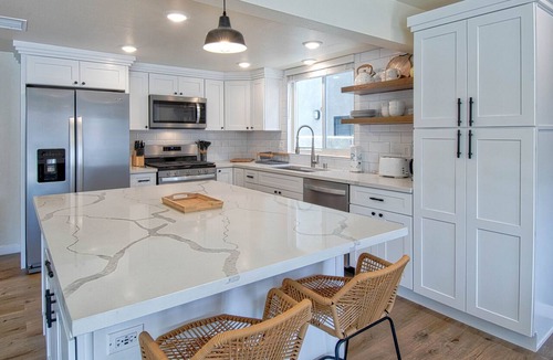 West Newport Condo | Spectacular ocean views await you from the large patio at this newly remodeled lower unit!