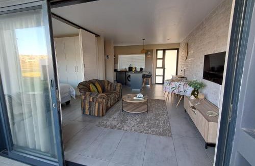 Jeffreys Bay Apartment | Sunlit Shores welcoming coastal apartment located in a secure beach estate