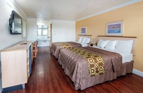 Corcoran Hotel | Welcoming Guest Room with Private Bath and Microwave, Perfect for Quick Escapes