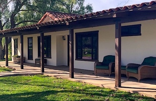 Solvang House | Wine Country Modern Ranch House on a tree lined pond.