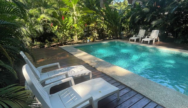 2 1 bedroom cabins with a pool 1 bathroom kitchen, living on a covered deck