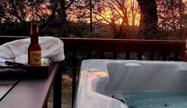 2 Br 2 Ba upstairs in cabin w/hot tub on 5.6 acre. Next to a Creek/near a lake