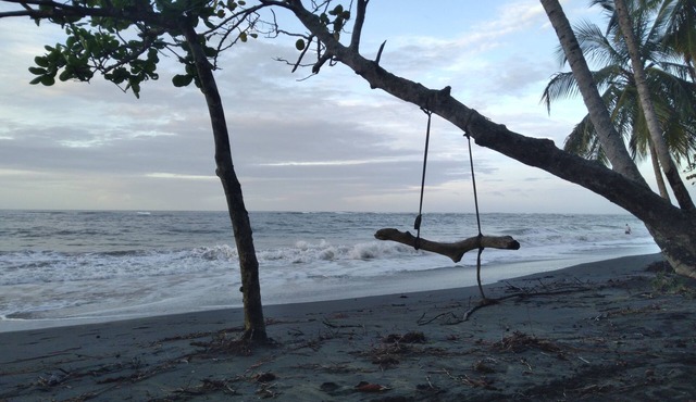 Big Beachfront House , 2 bathrooms, A/C, hot showers, 2 kitchens, & porch!