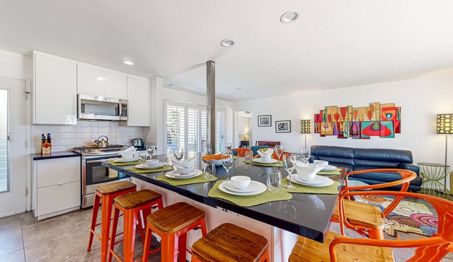 Color-filled charmer with pool & tennis access, patios, and AC