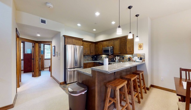 Comfortable townhome with golf-course view, hot tub, two decks, & W/D
