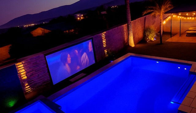 Family Oasis w/Glamping Yurt, Poolside Movie Nights, Golf Simulator, Game Room setup with poker, air hockey, arcade-style games, Xbox, Nintendo Switch 2, karaoke, and plenty of space for the group to relax and play together.
