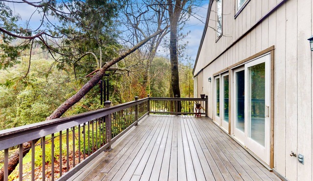 Garden-surrounded stay with fireplace, balcony, smart TVs, W/D, & central AC