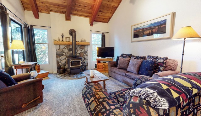 Homey Condo, Right Across from The Village! Forested Setting & Balcony