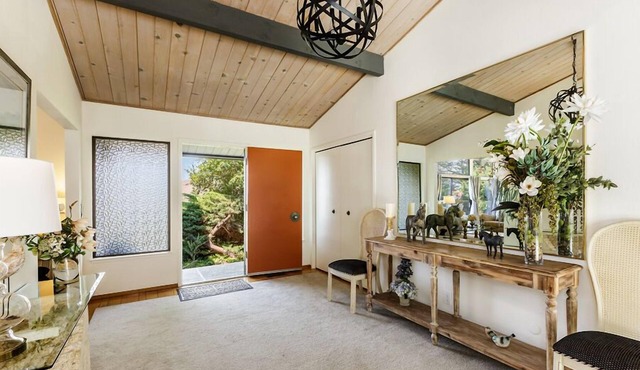 Mid-Century home with beautiful views, deck, & rear fenced-in patio