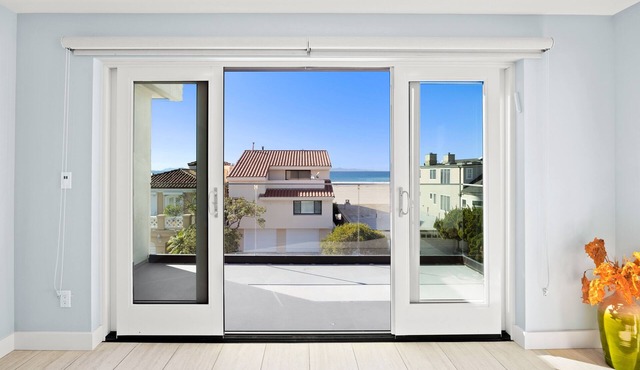 Ocean view modern home with bikes, grill, game tables, fireplace, W/D, & AC