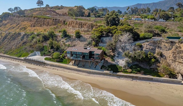 Oceanfront 2BR duplex with two king suites, beach access, AC, grill, and balcony.