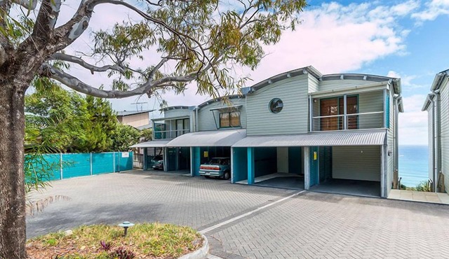 Panoramic ocean and beach views from this beautifully appointed two.