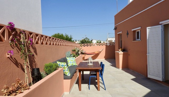 Romantic village house with spacious roof terrace and patio