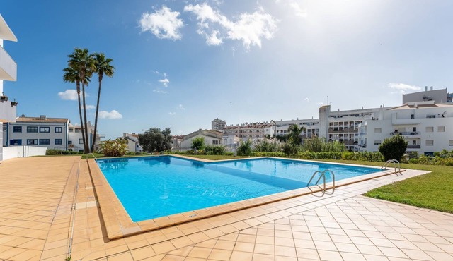 Sunny Retreat w/Pool and Balcony by LovelyStay