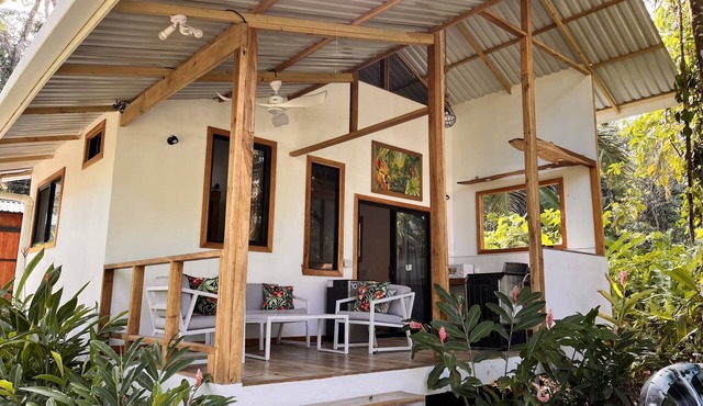 Villa Green Macaw Comfortable Beach Front Villa, sea breezes, Tropical gardens